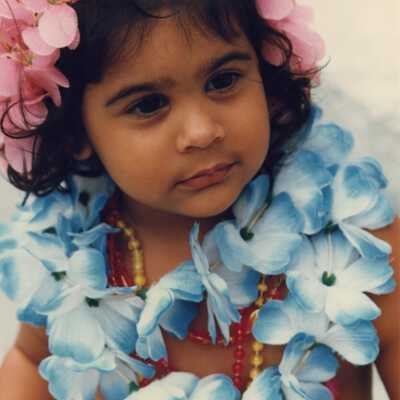 An unknown little girl dressed up.