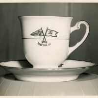 A mug and plate, that reads Martha III