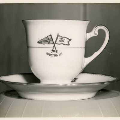 A mug and plate, that reads Martha III