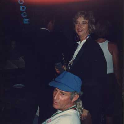 Unknown man and woman looking over at something near by.