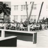A group of people sitting at a ceremony