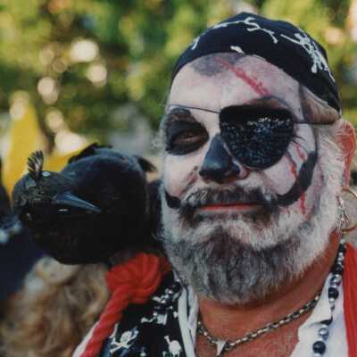 An unknown man with his face painted.