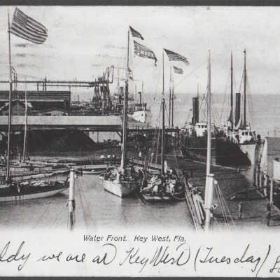 Sailboats and steamers at dock