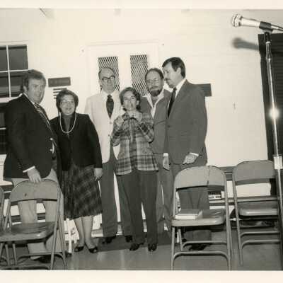 Unknown people standing at a ceremony
