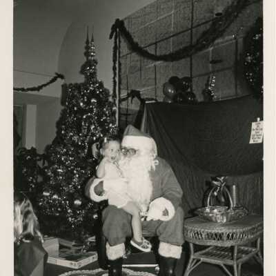 An unknown child sitting on Santa's lap
