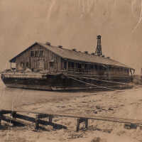 A houseboat used when constructing the railroad