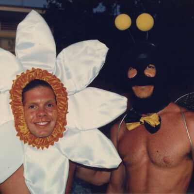 Unknown men dressed up as a flower and bumble bee.