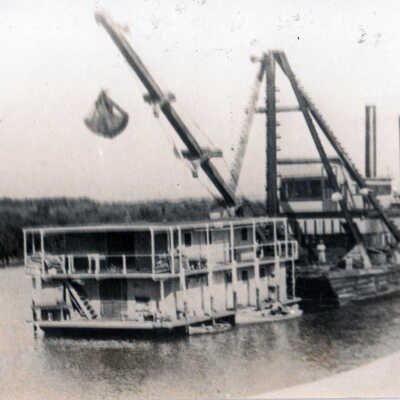 Houseboat and crane barge used in constructing the railroad