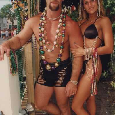 Two unknown people dressed up.