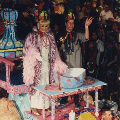 Unknown people dressed up on a float in the parade.