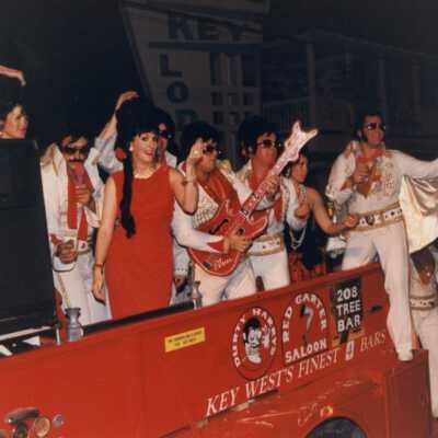 Unknown people dressed up on the Rick's complex float.