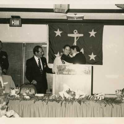 Unknown people at a podium