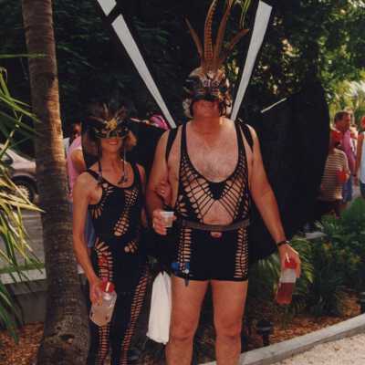 Two unknown people dressed up.