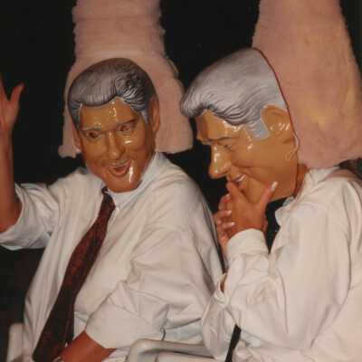 Two unknown people dressed up.