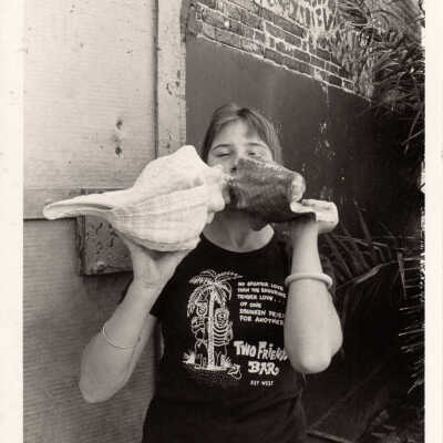Woman with conch shells