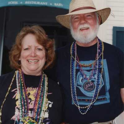 Unknown woman and man standing in front of La te da.