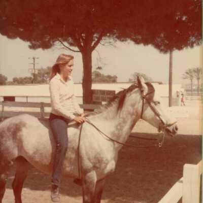 An unknown woman on a horse