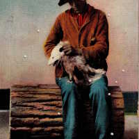 Man holding an animal