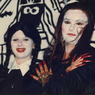 Two unknown woman dressed up.