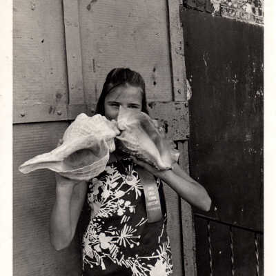 Woman with conch shells
