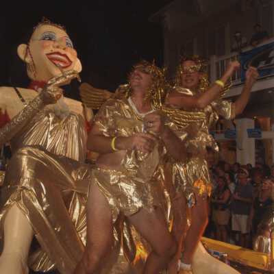 Unknown people dressed up on a float.