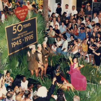 Float in the parade that reads Marathon chamber of commerce 1945-1995.