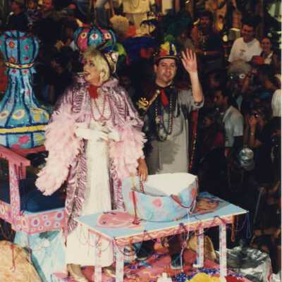 Unknown people dressed up on a float in the parade.