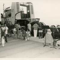 A group of people near a boat