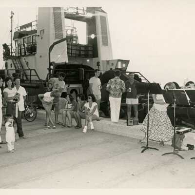 A group of people near a boat