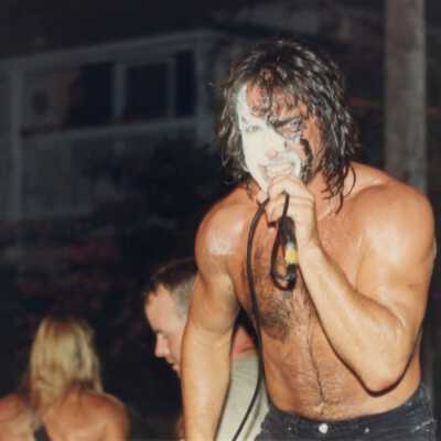 Unknown man with his face painted a microphone.