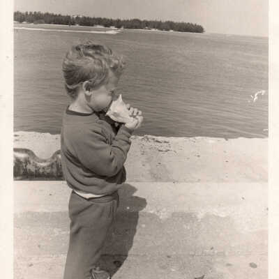 Young boy with conch shell