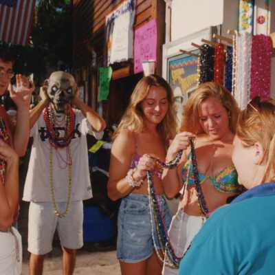 Unknown people looking at beads.