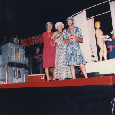 Unknown people dressed up on a float that reads Bates Motel.