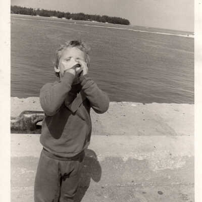 Young boy with conch shell