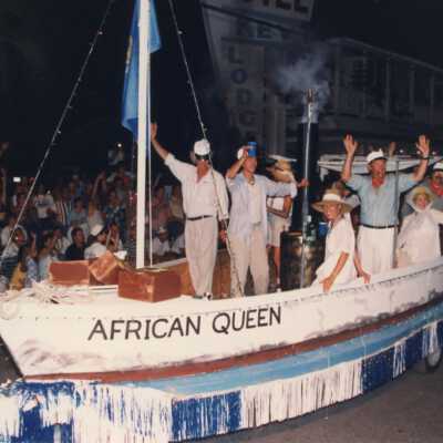 Unknown people dressed up in a float that reads African Queen in the parade.