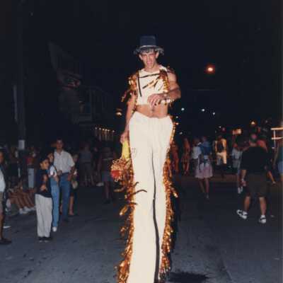 Unknown man dressed up walking in the parade.