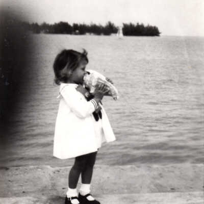 Young girl with conch shell
