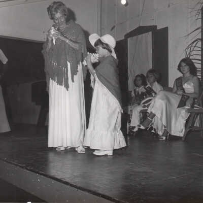 Woman and girl with conch shells