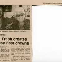 An article and a picture in the Key West Citizen that reads Tasty Trash creates Fantasy Fest crowns.