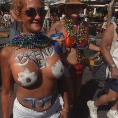 Unknown woman with her breast painted.