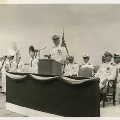 Unknown men at a ceremony