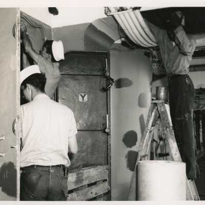 U.S. Navy men working on a ship