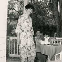 An unknown woman standing