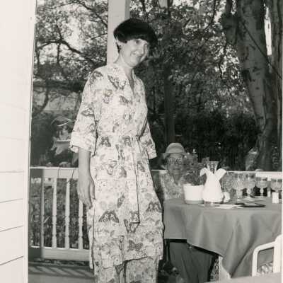 An unknown woman standing