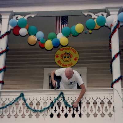 Unknown man decorating an unknown place.