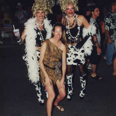 Unknown people dressed up in the street.