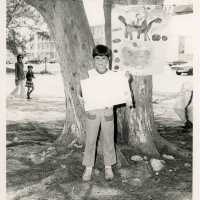An unknown child showing some artwork