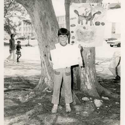 An unknown child showing some artwork