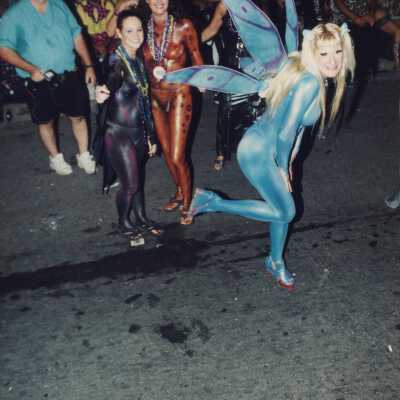 Unknown people dressed up on the street for the parade.