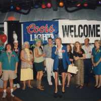 A group of unknown people standing on a stage.